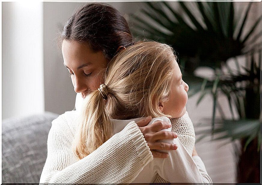 A hug between mother and daughter.