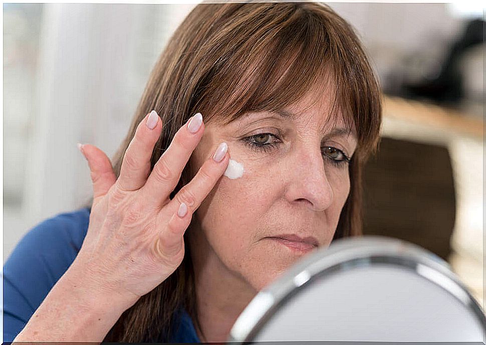 Woman using face cream