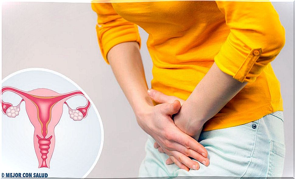 Woman touching her abdomen for the pain caused by polycystic ovary syndrome