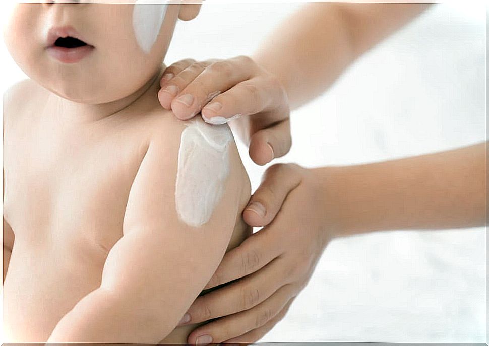 Baby with body cream