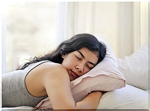 Woman hugging her pillow.